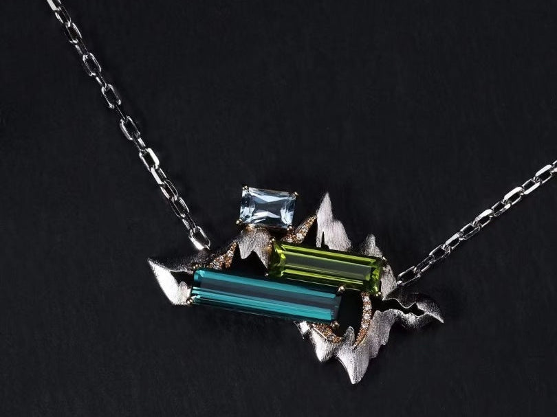 Titanium pendant necklace with geometric multicolor lab-grown gemstones, modern prism design from Elysia’s Titanium Collection